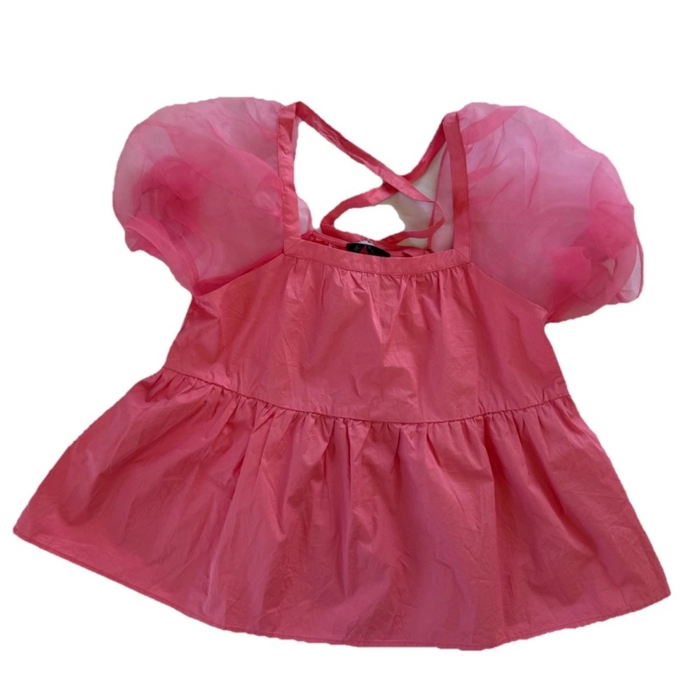 Tuckernuck Pomander Place Tinsley peplum top in pink with sheer puff sleeves